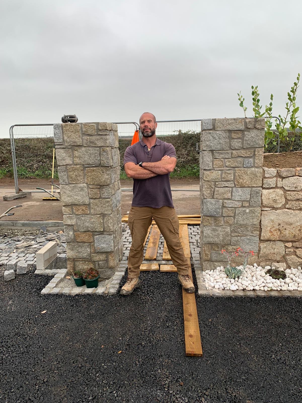 Ty on site beside stonework